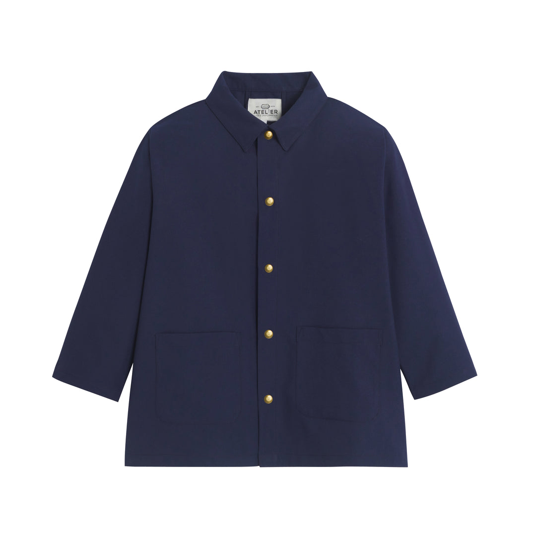 Tablier d'école Maternelle Mixte Auguste en polyviscose, affichant un design coloré et un style adapté aux enfants.