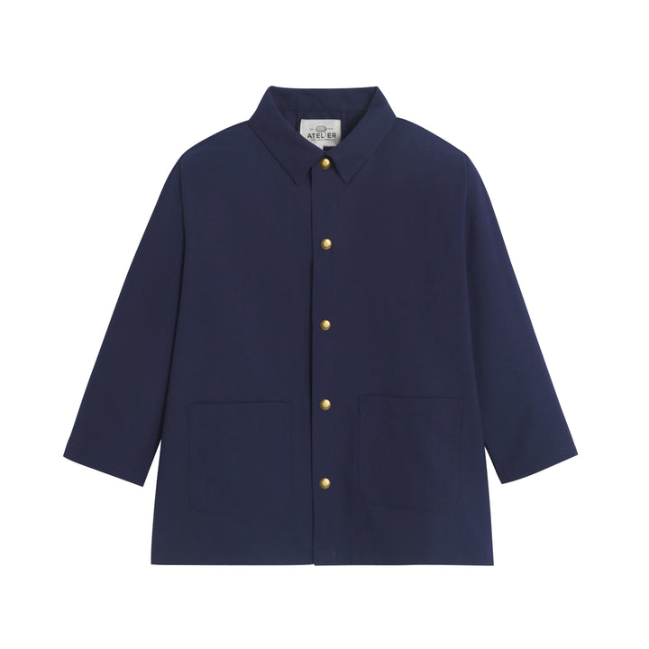 Tablier d'école Maternelle Mixte Auguste en polyviscose, affichant un design coloré et un style adapté aux enfants.