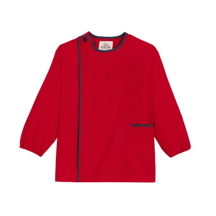 Red unisex school apron BAPTISTE by My Store, featuring adjustable straps and a spacious front pocket.