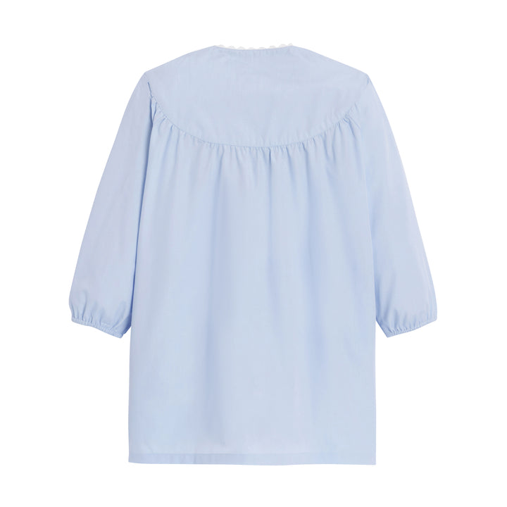 Tablier d'école fille Jeanne en bleu ciel, vue de dos, avec un design simple et confortable pour les enfants.