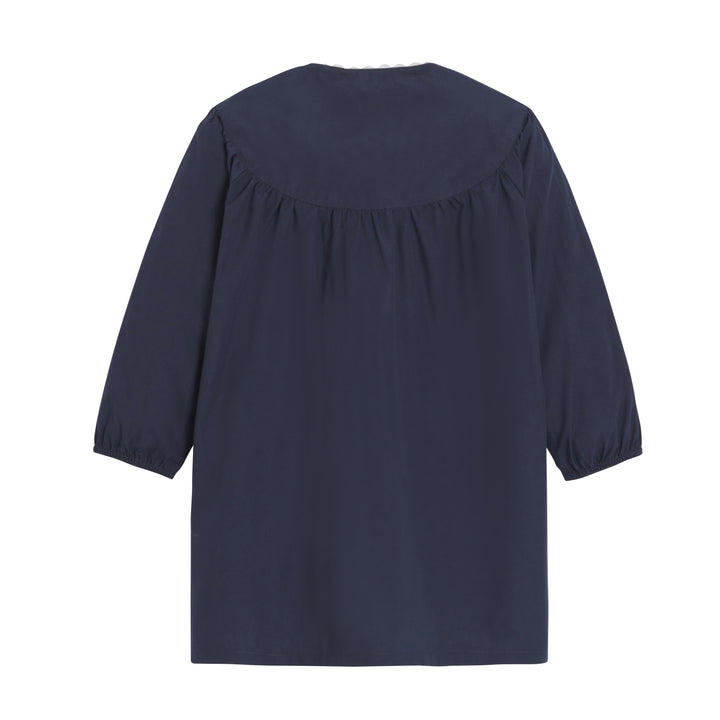 Tablier d'école fille Jeanne en marine, vue de dos, avec des bretelles et une coupe élégante pour enfants.