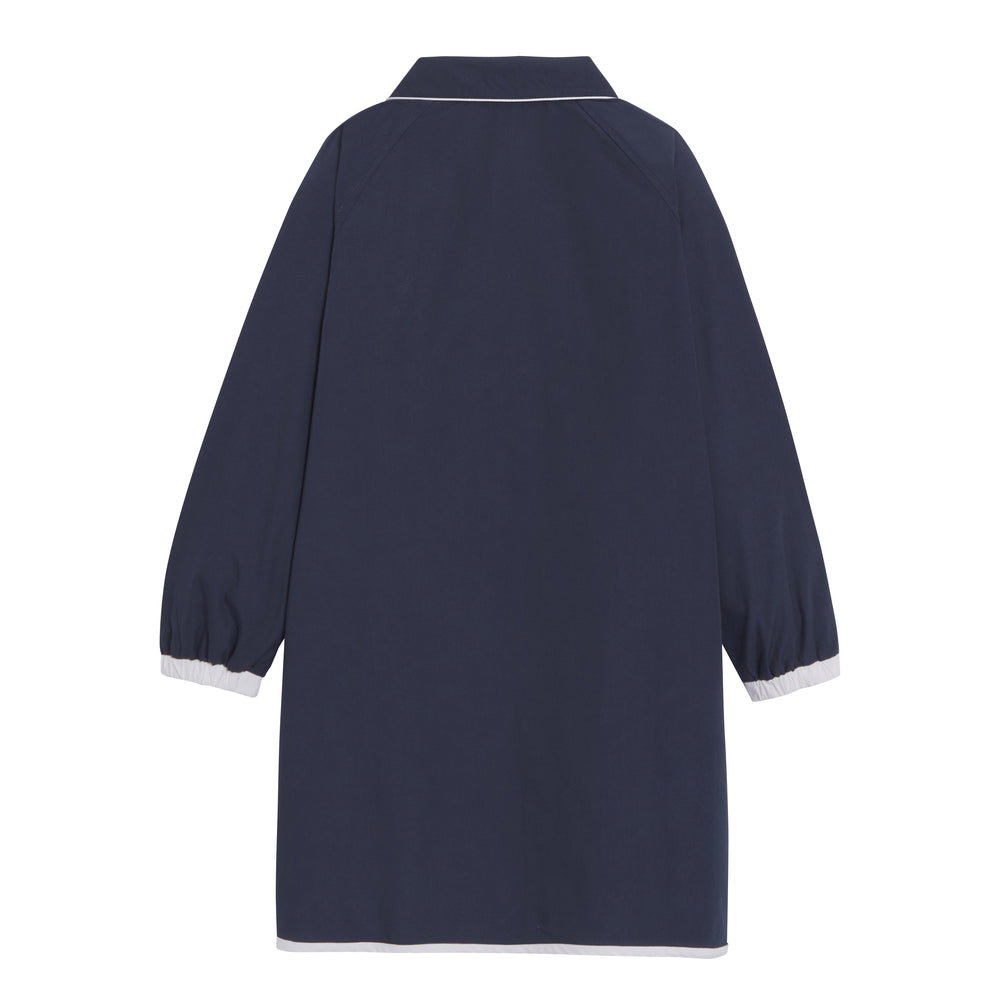 Fille's Josephine school apron in marine color, showcasing the back design and adjustable neck straps.