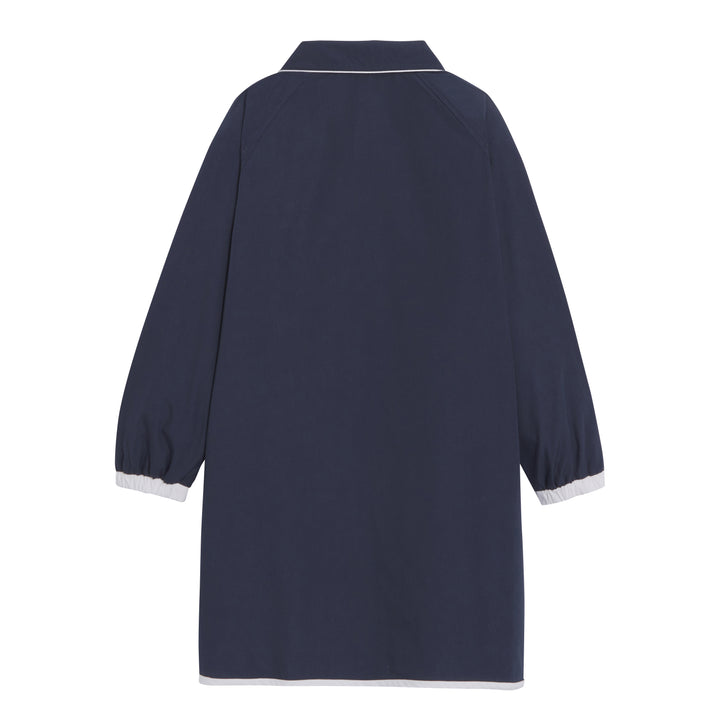 Fille's Josephine school apron in marine color, showcasing the back design and adjustable neck straps.