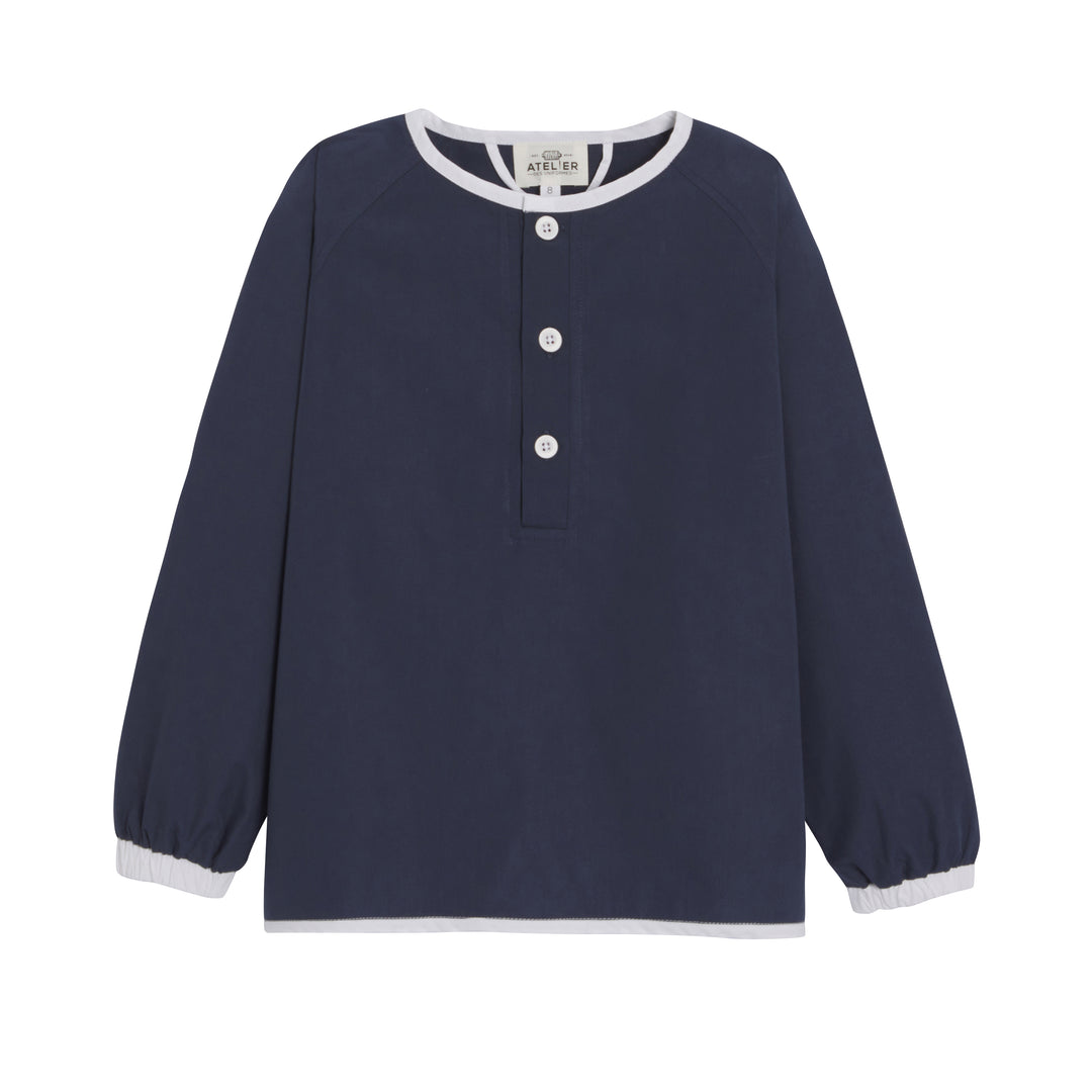 Mixte school apron in marine blue by JOSEPH, featuring a classic design suitable for children.