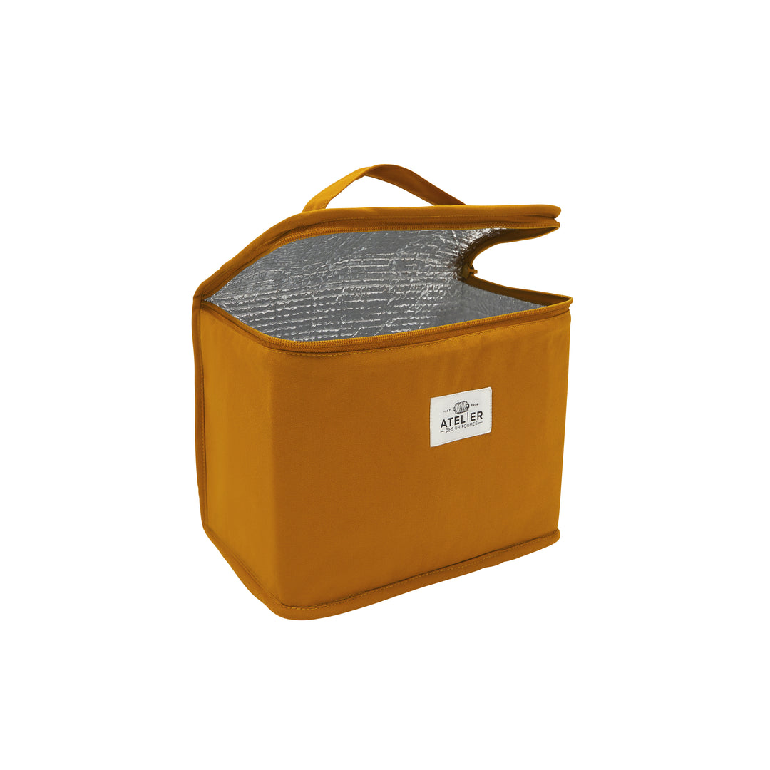 Sac à déjeuner jaune en forme de vélo, ouvert, montrant son espace de rangement intérieur.