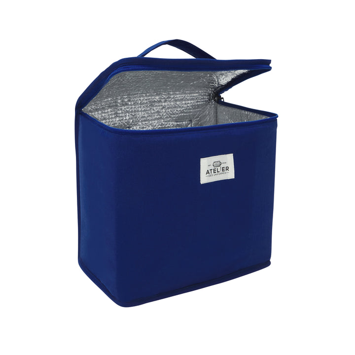 Sac à déjeuner bleu avec motif de vélo, ouvert, montrant l'intérieur spacieux et compartiments organisés.